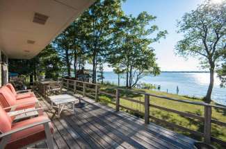 Sunny Shelter Island Waterfront with Dock and Sandy Beach